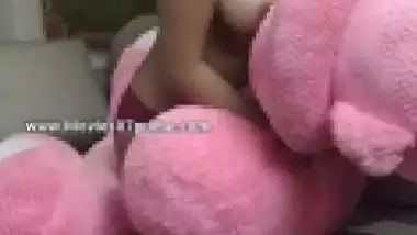Indian teen is so horny that rubs twat against big plush toy on camera